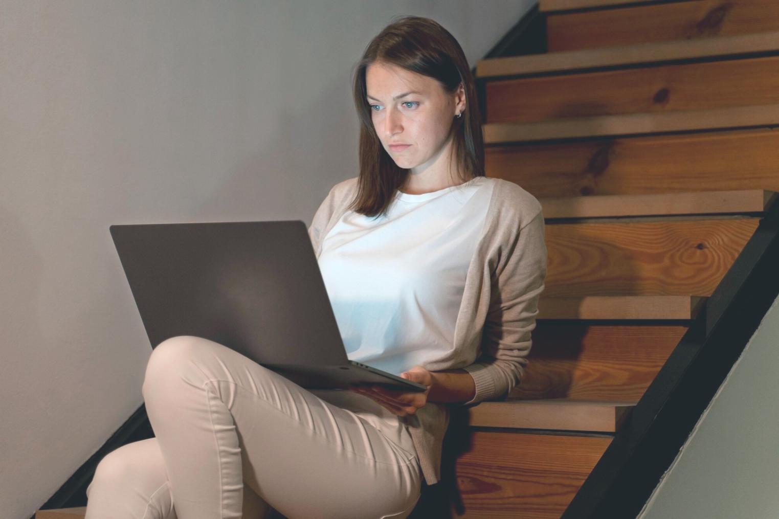 Student reviewing budget on laptop